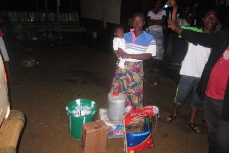 Annie Sonya receive donation after her husband who is a commercial driver transported an Ebola Patient who later died-He's being quarantined at home in diamon rich Lofa Bridge 