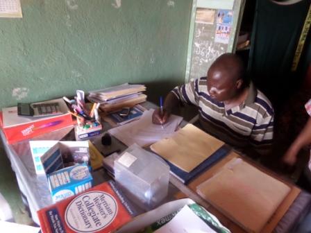 Calvary Community School Proprietor - Rev. Moses S. Maomou Signs contract